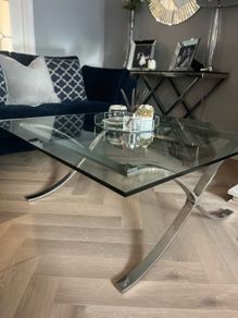 Glass coffee table with chrome legs