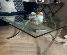Glass coffee table with chrome legs