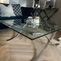 Glass coffee table with chrome legs
