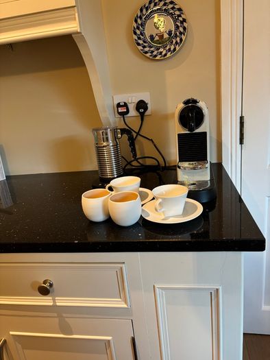 Nespresso espresso machine, milk frother and cups
