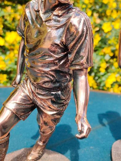 Two Gilded footballers