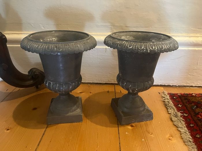 Pair of grey urn ornaments