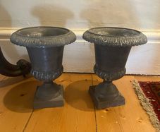 Pair of grey urn ornaments