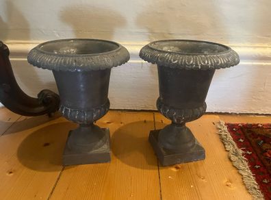 Pair of grey urn ornaments