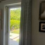 Set of two eyelet curtains and curtain poles Image 2