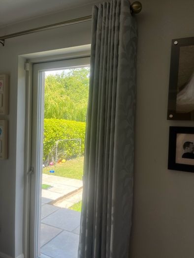 Set of two eyelet curtains and curtain poles