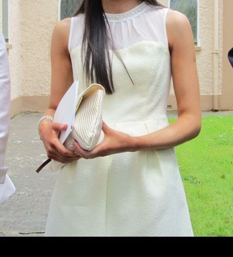 Dress with pearl neckline