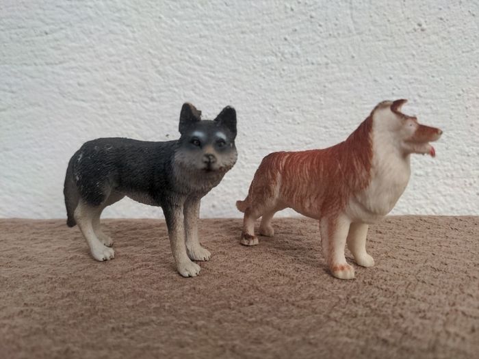 Two toy dog figures