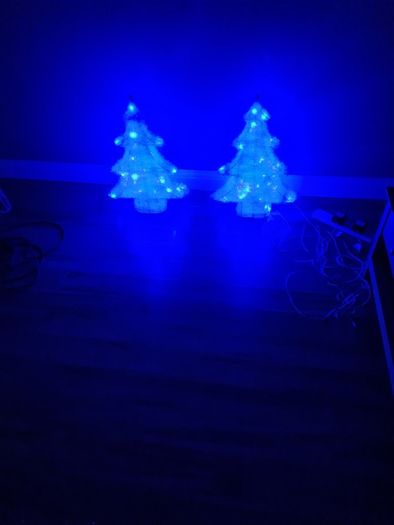 2 blue plug in Christmas trees.