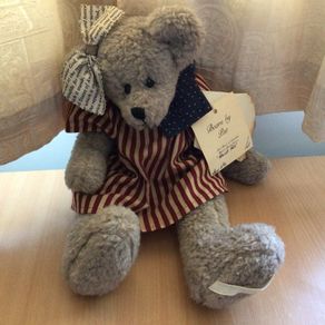 collectible tradtional style glass eyed Teddy bear dressed in usa stars and stripes
