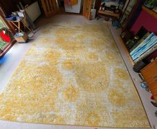 Large yellow and cream rug