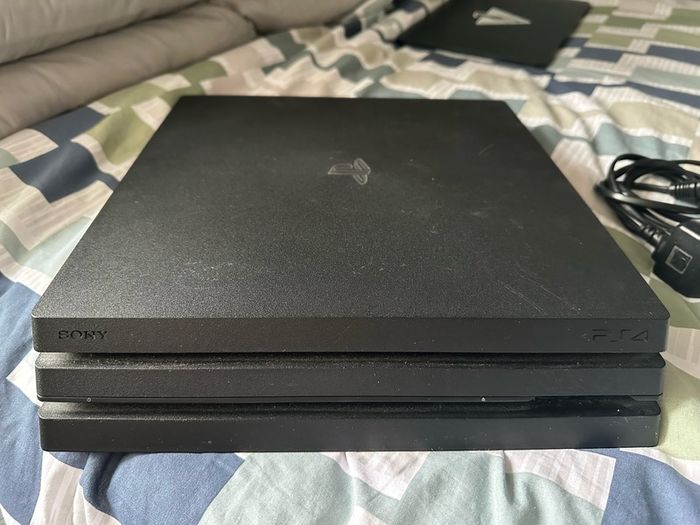 PlayStation 4 Pro 1TB SSD with games, cables and controller