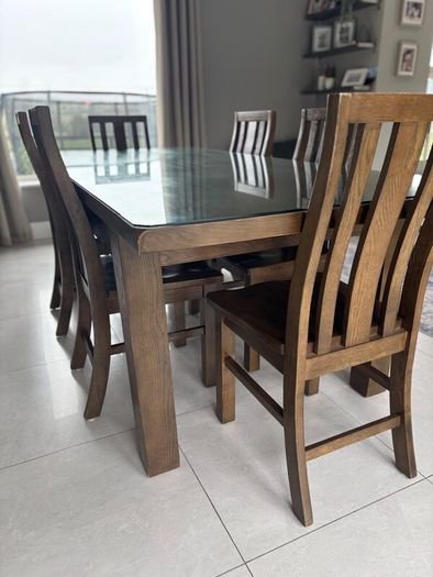 Dining table with glass top and 8 dining chairs