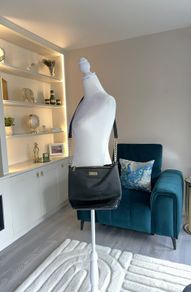 Carvela Black Handbag with gold chain.