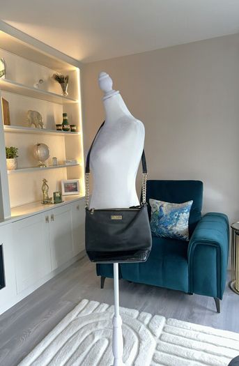 Carvela Black Handbag with gold chain.