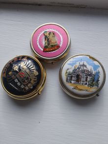 Three vintage pill boxes.
