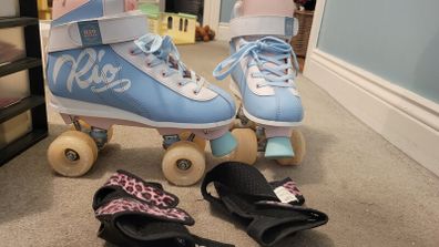 As new Rio roller skates Size 6 and wrist guards