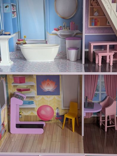 Large wooden dolls house with furniture