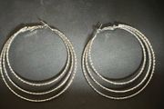 Stylish silver-tone earrings in excellent/new condition.