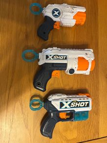3 Xshot guns and targets and bullets