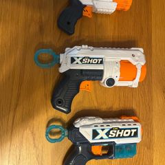 3 Xshot guns and targets and bullets