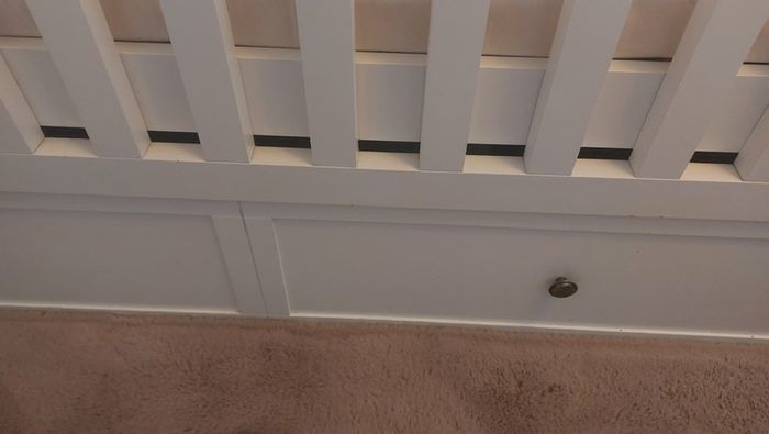 Cot that converts to toddler bed with underbed storage