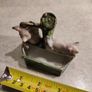 figurine of two pigs cooling down at bone china  water pump. Image 2