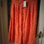 Asos Printed Crepe Midi Skirt features an orange ditsy floral print and a button down front. New with Tags Image 2