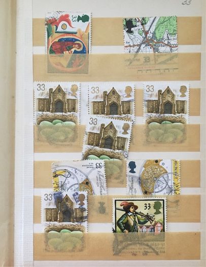 Small brown stamp stock book. 13cm x 18.5cm. 24 page / 12 leaf. Album contains used England Stamps with values over 29p