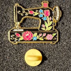 Sewing machine, pin back badge.