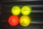 (4) Wilson colored golf balls