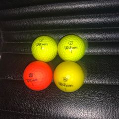 (4) Wilson colored golf balls