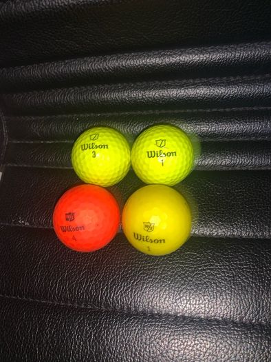 (4) Wilson colored golf balls