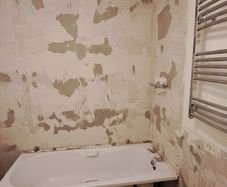 All together - bathtub, sink with a tap, bathtub glass, wall tiles