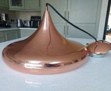 Copper pendant ceiling light. Lovely shape.