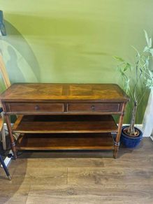 Wooden console table with two drawers and shelves