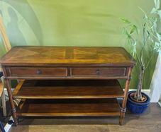 Wooden console table with two drawers and shelves