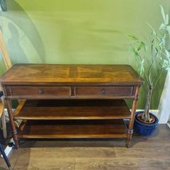 Wooden console table with two drawers and shelves