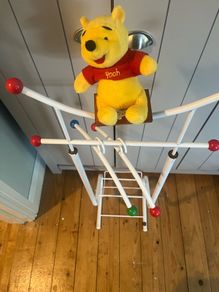 Antique baby clothes rack Winnie the Pooh