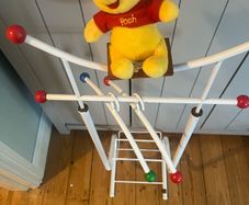 Antique baby clothes rack Winnie the Pooh