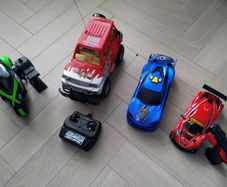 3 remote control vehicles & 1 blue racecar with lights & sounds