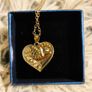 Heart-Shaped Pendant Necklace with Red Glass Heart and Wing Details Image 4