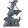 Girl sitting on a dolphin figurine Image 8