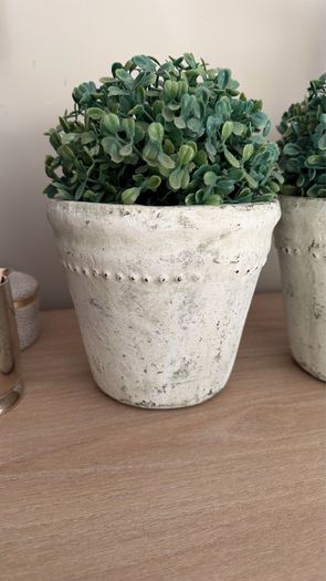 Two pots with faux trees