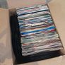 a box of 7" singles. 45 rpm vinyl records. Image 2