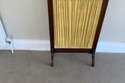 A restored Edwardian oak fire screen, 76 centimetres high, 52 centimetres wide