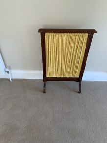 A restored Edwardian oak fire screen, 76 centimetres high, 52 centimetres wide