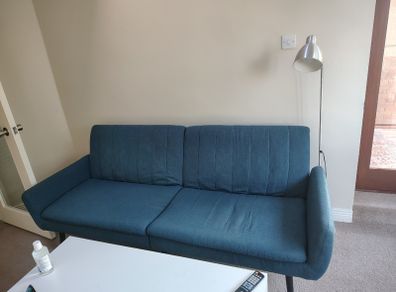Blue fabric sofa bed