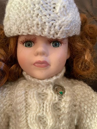 5 porcelain dolls with extra clothing perfect condition