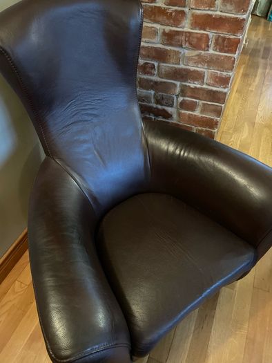 Real leather brown arm chair with foot stool